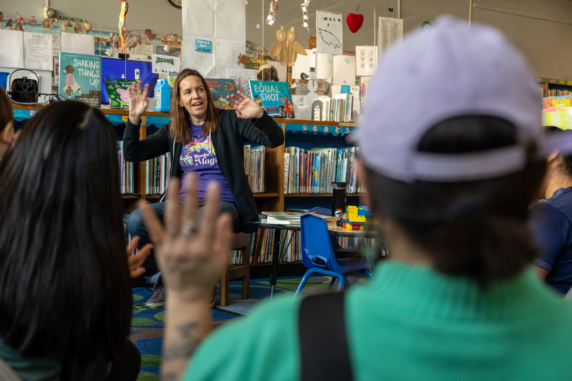 Tarryn, the children's librarian at Kensington Library, reads to kids during preschool story time