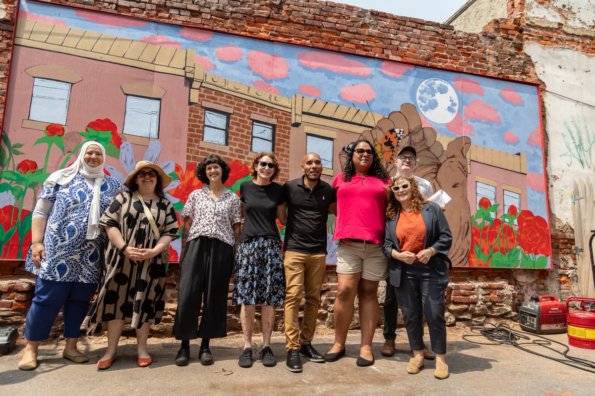 Local artist creates new mural at the Love Lot: “Reciprosity is a mutual exchange”